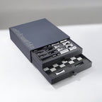 Set of Chess Pieces in a gray box on a white background