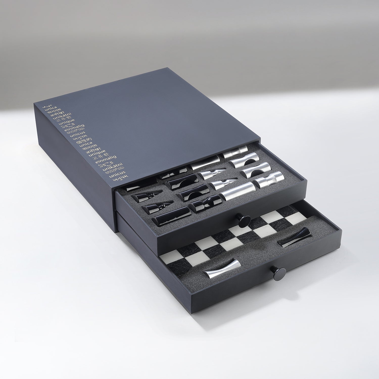Set of Chess Pieces in a gray box on a white background