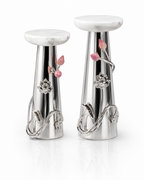 A pair of silver-toned decorative pedestal stands with white marble-look round tops, featuring pink floral accents and clear crystal-like flower details on a clean white background.