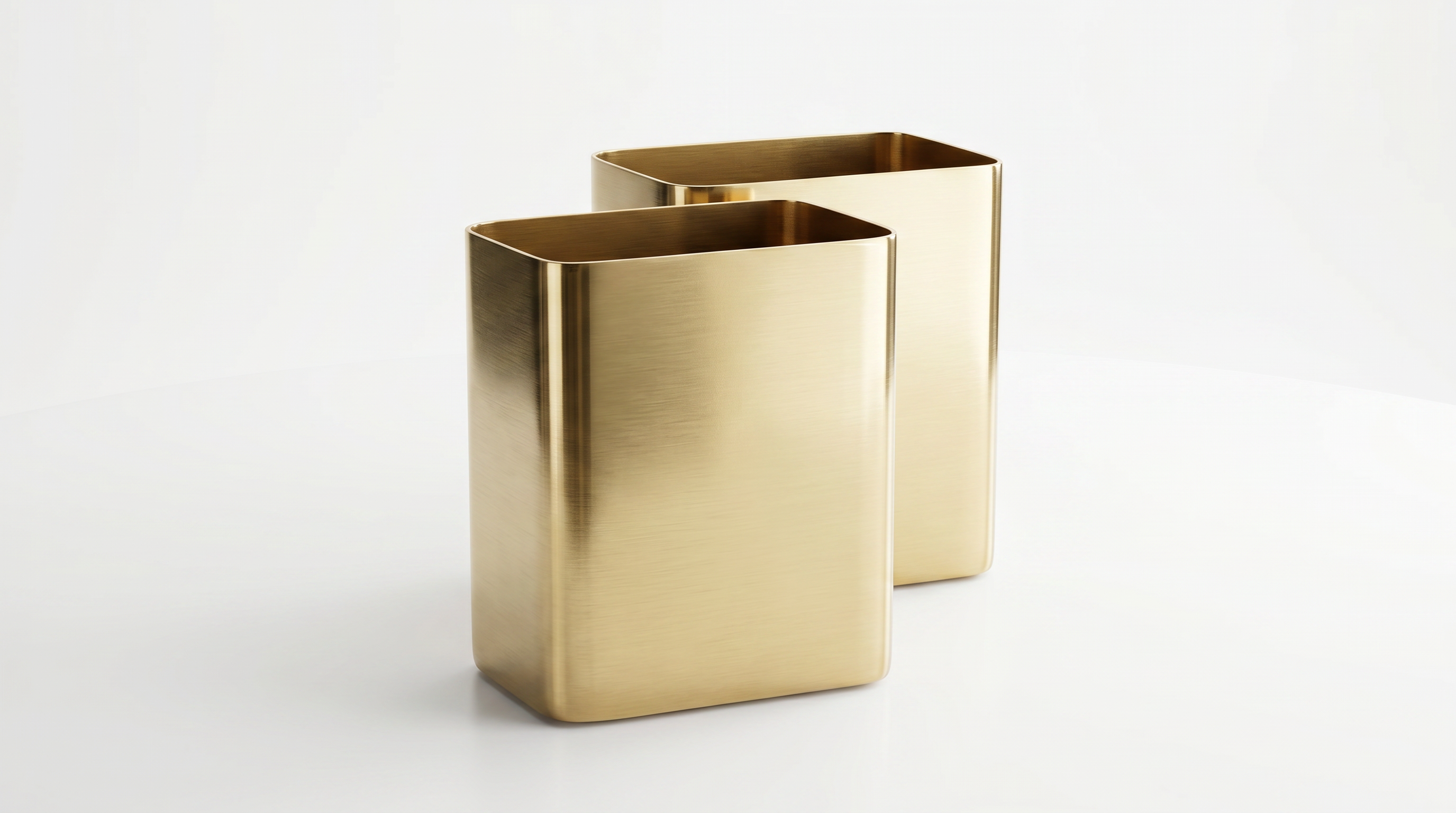 Two gold rectangular vases on a white background