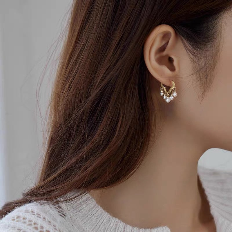 Gold and pearl earrings
