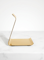 Gold metal object on a white background