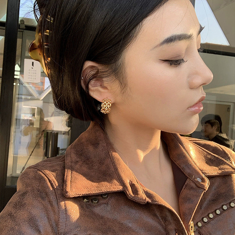 Woman wearing gold hoop earrings
