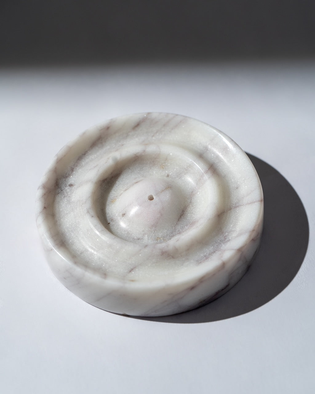 Marble Incense Stick on a light grey background
