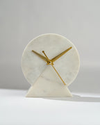 Marble clock with gold hands on a white background