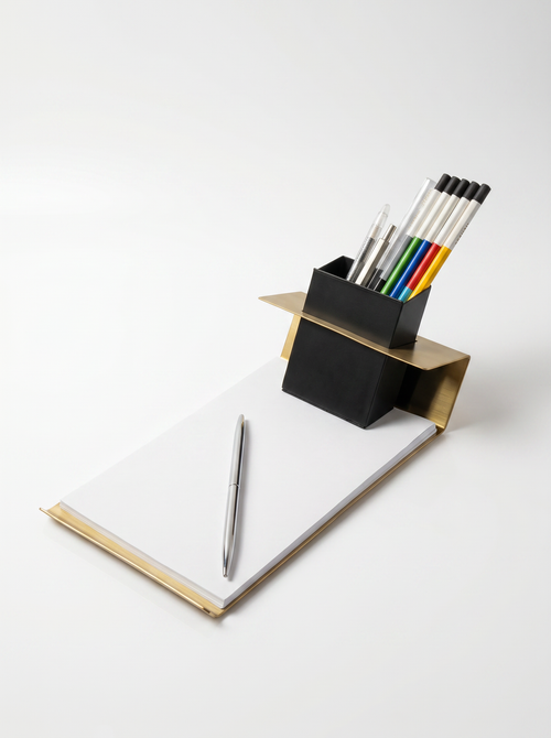Pencil holder with pens on a white background