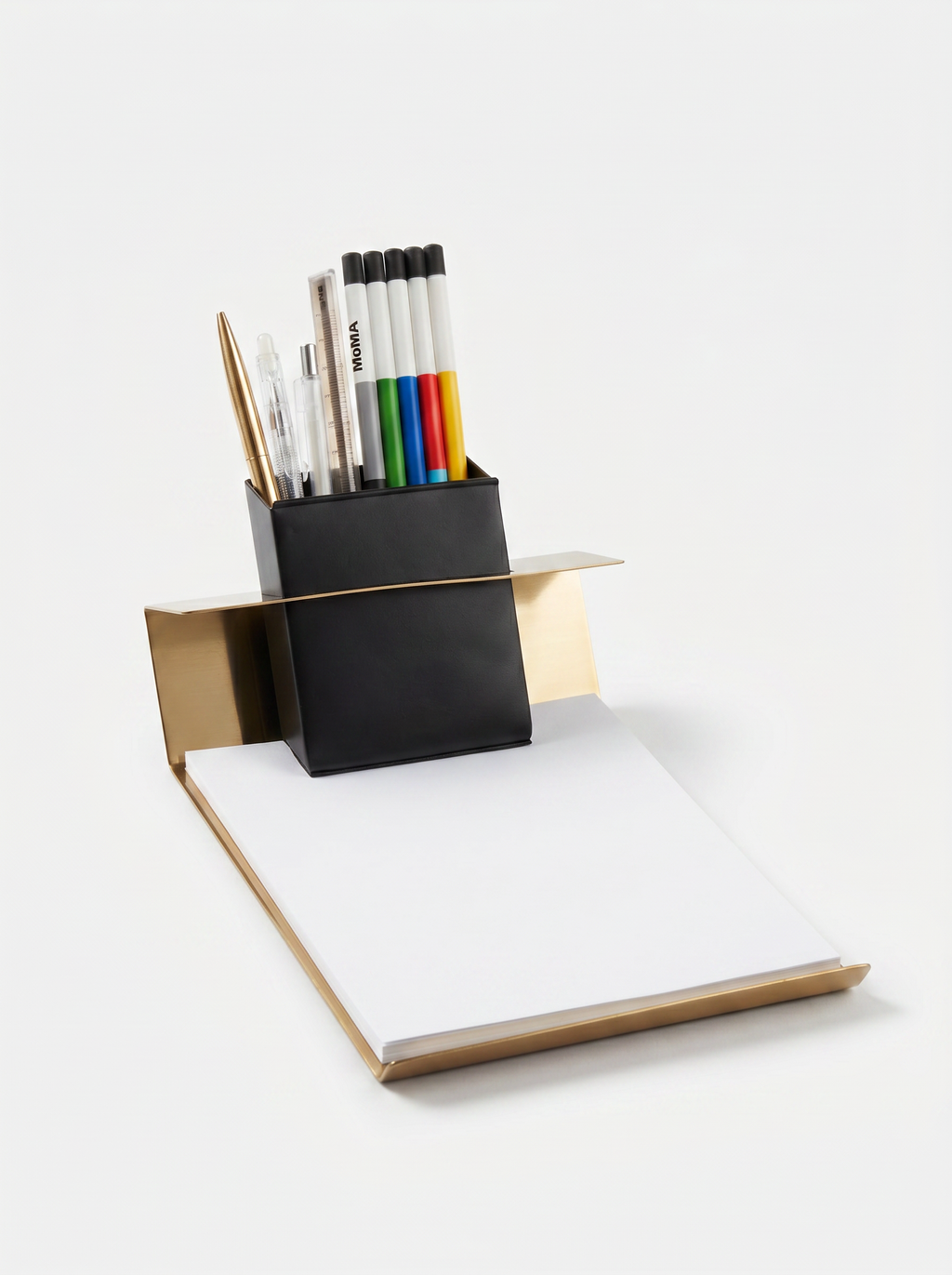 Desk organizer with pens and a notebook on a white background