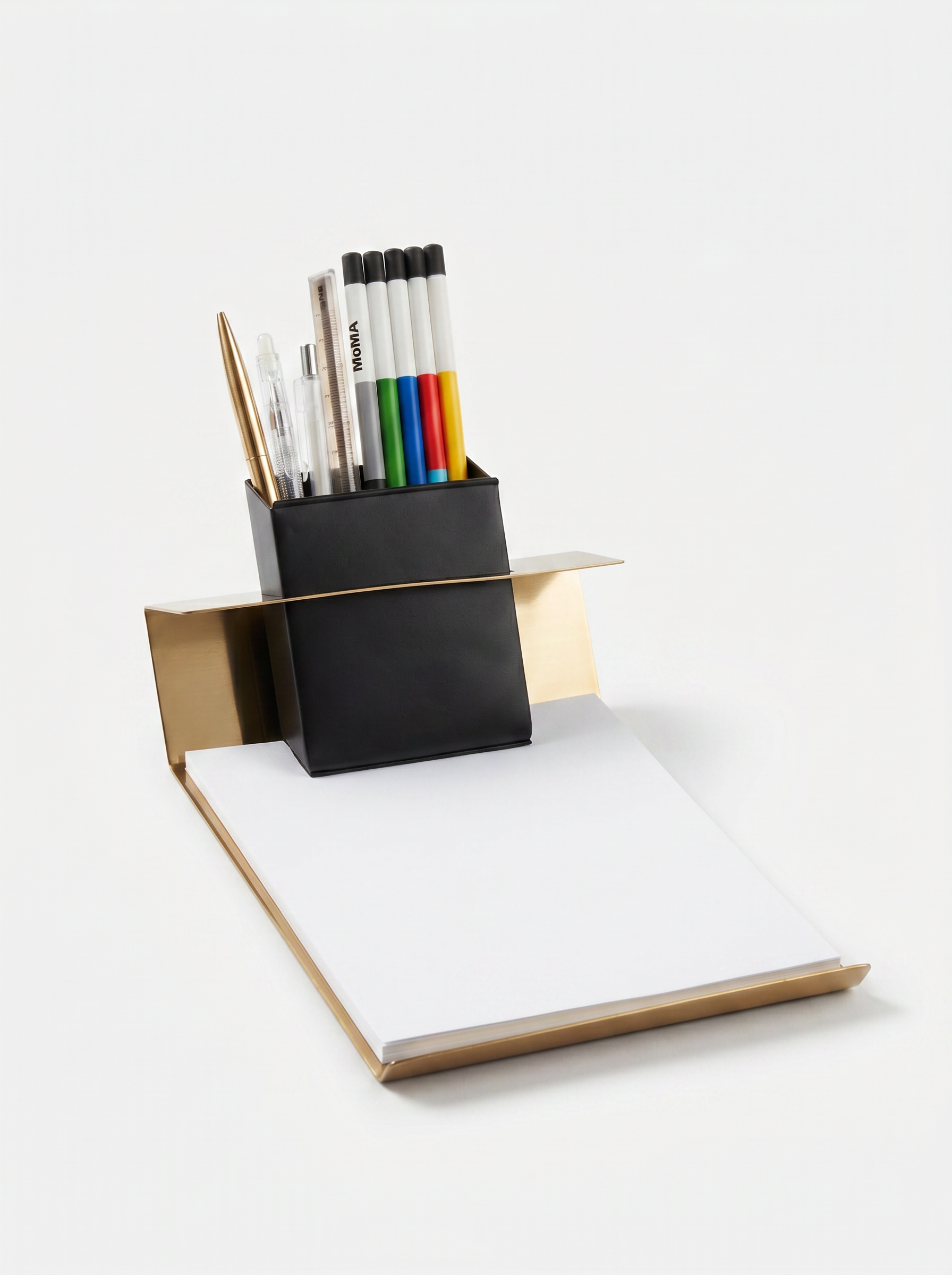 Desk organizer with pens and a notebook on a white background