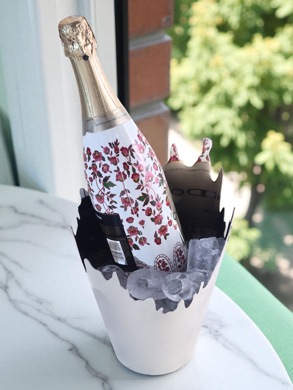 Ice bucket with ice and champagne bottle