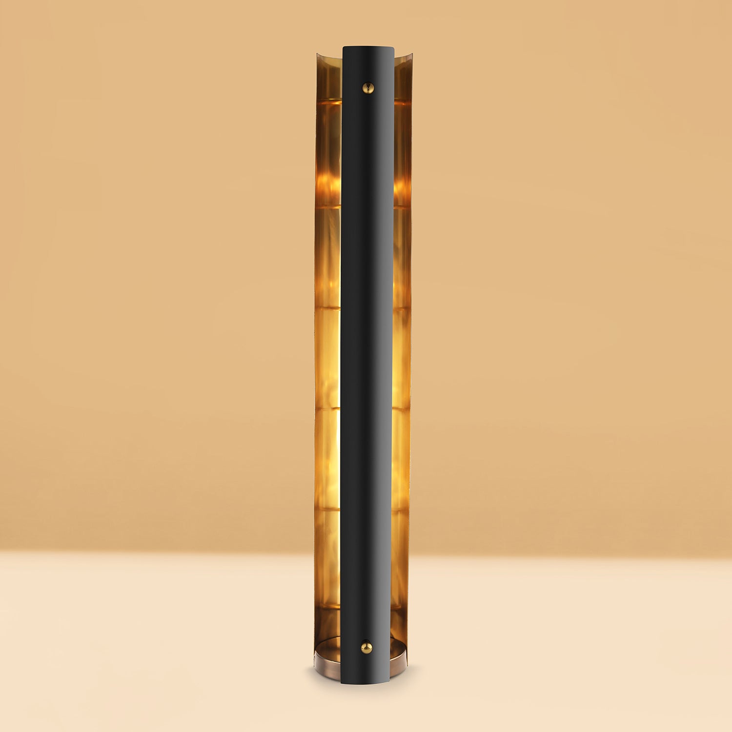 Black cylindrical lamp with a warm glow