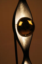 Decorative lamp with a reflective surface on a brown background