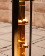 Tea Lights burning in a tall lamp