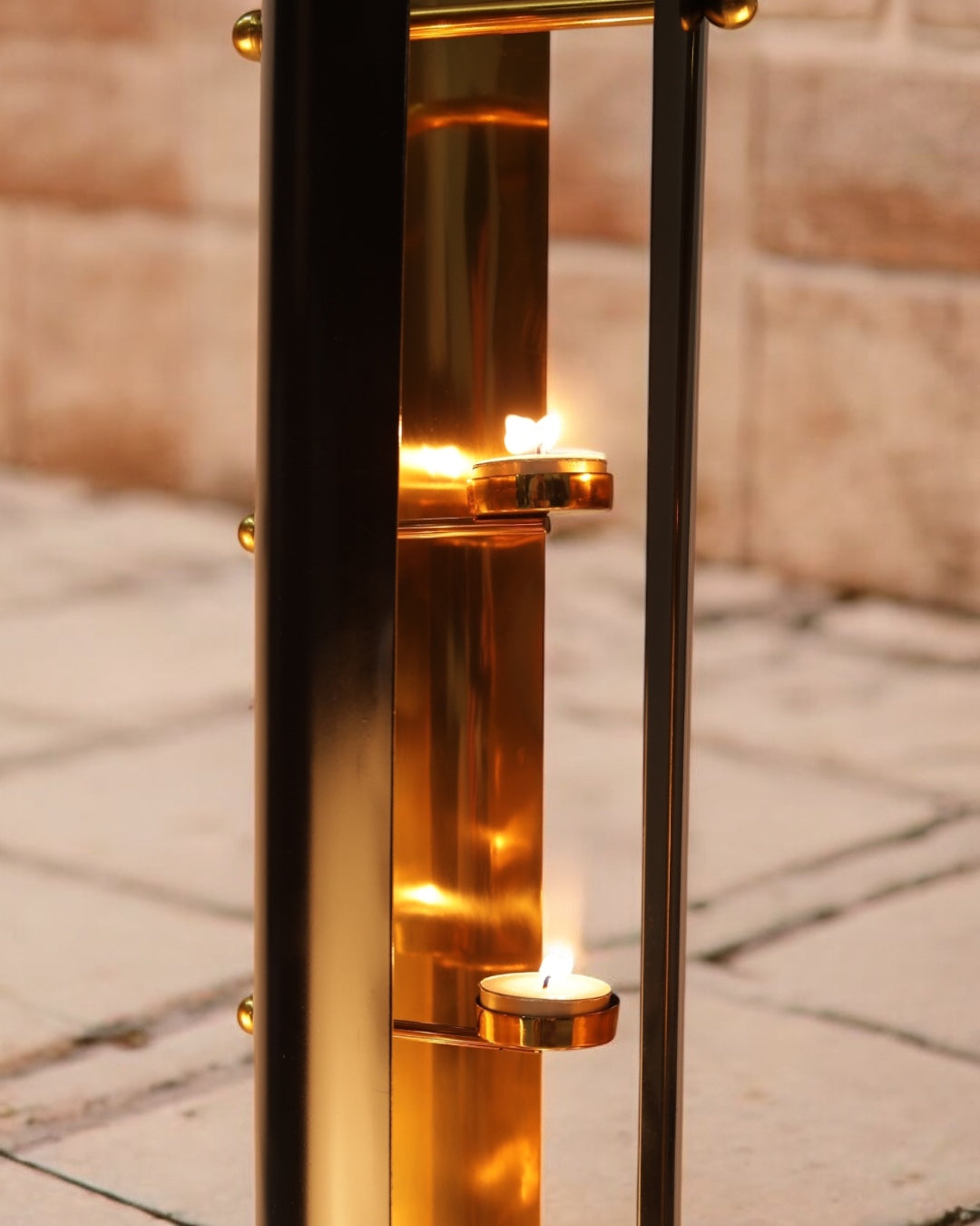 Tea Lights burning in a tall lamp