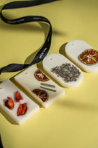 White wax bars with natural elements on a yellow background