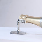 champagne bottle on a silver wine rest