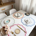 Dining Table placemats in white with colourful borders.